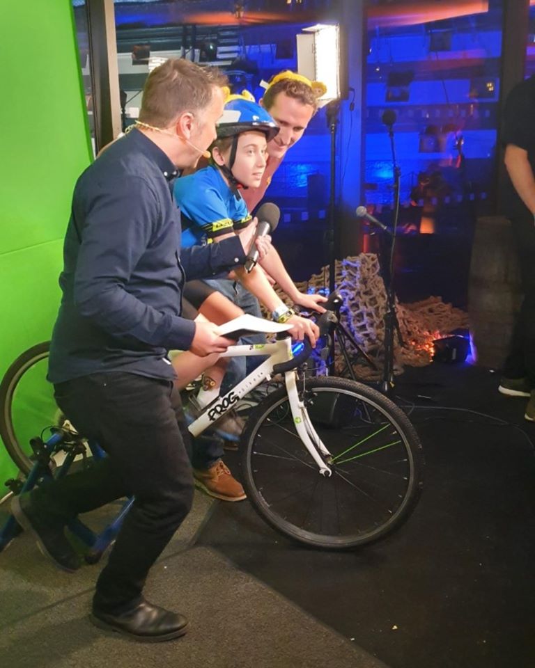 Ethan cycling on the set of the live broadcast for BBC Chidren in Need